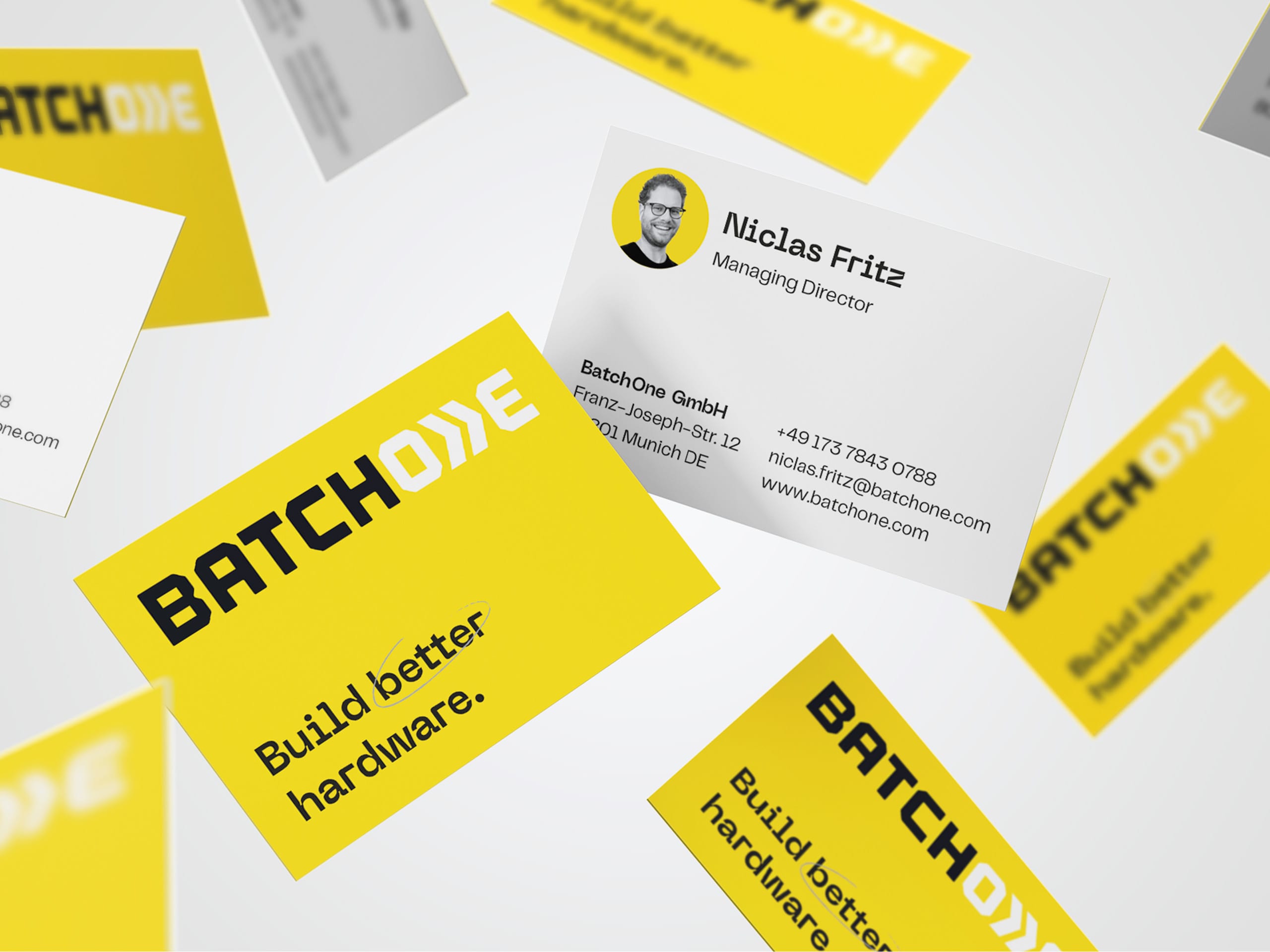 Business card design with logo and claim on bright yellow.