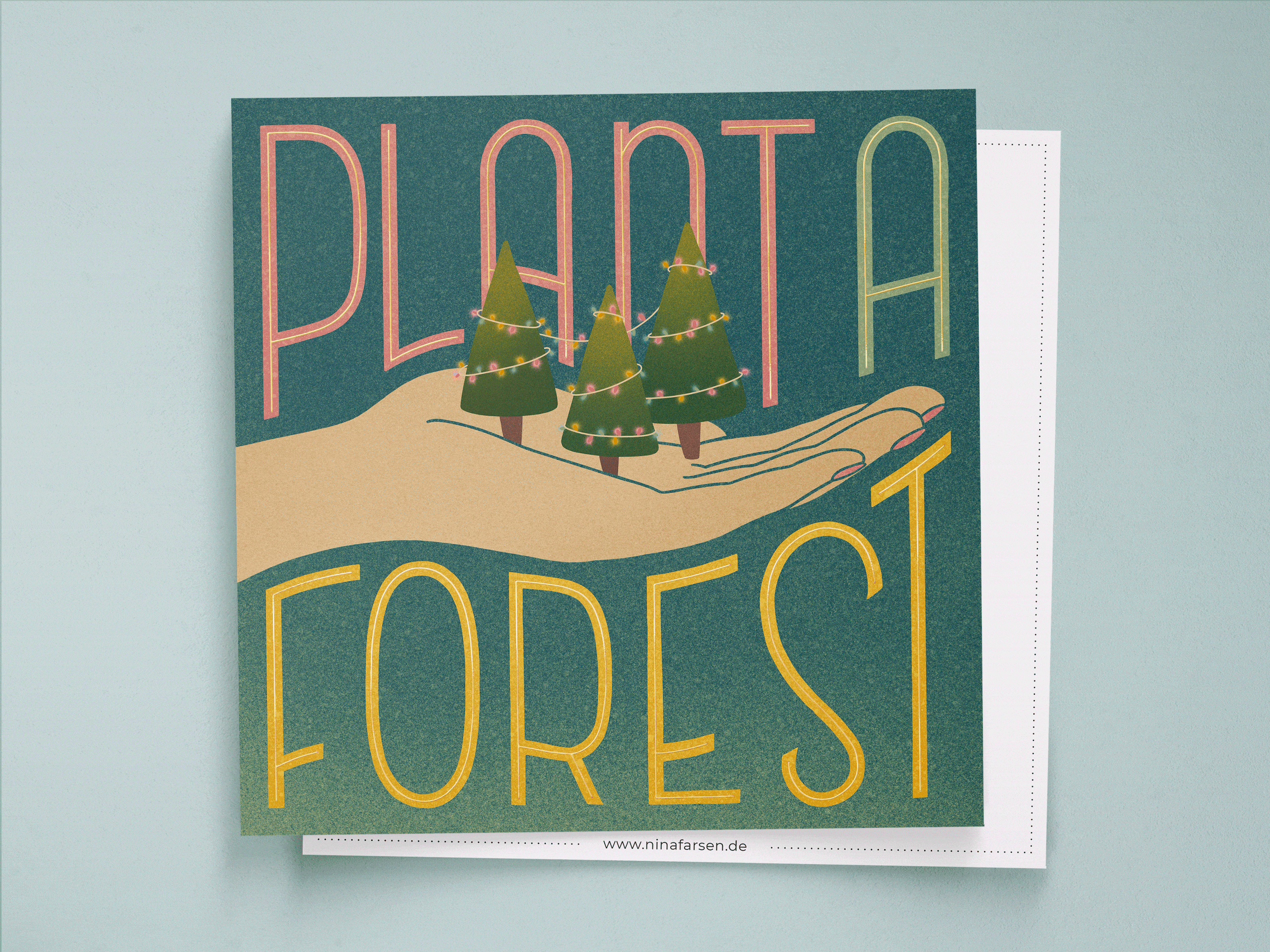Postcard with an illustration of decorated Christmas trees in a hand. Custom lettering saying "Plant a forest".