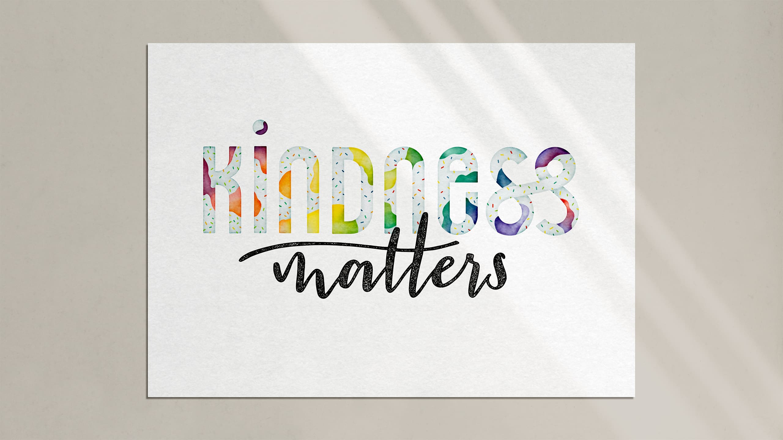 Hand lettering of the words "Kindness matters" in a bright modern style